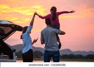  Asian Family Enjoying. Happy Little Girl With Family Sitting In The Car.Car Insurance Concept