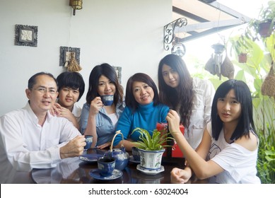 Asian Family Enjoying Tea Time