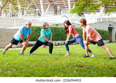 Asian family exercising outdoors in the morning They smile happily. Sport concept, fitness family, health care. - Powered by Shutterstock