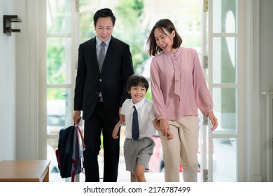 Asian Family, Father Mother And Her Son Go Back From School To They Home