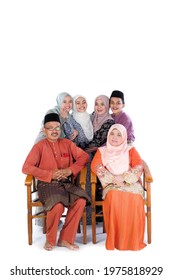 Asian Family Groups Wear Traditional Malay Dress During The Aidilfitri Celebration. The Concept Of Family, Happiness And Forgiveness