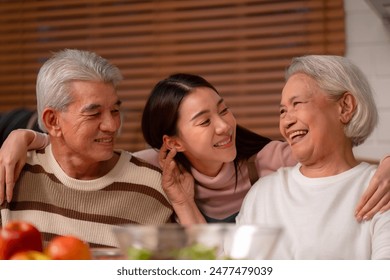 Asian Family Happiness in the Kitchen: Senior Parents Cooking Dinner with Joy, Children Laughing, A Fun and Loving Atmosphere of Togetherness, Creating Delicious Meals and Beautiful Memories - Powered by Shutterstock