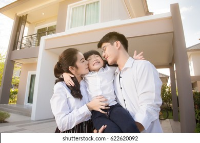 Asian Family Happy With Child Over House Background