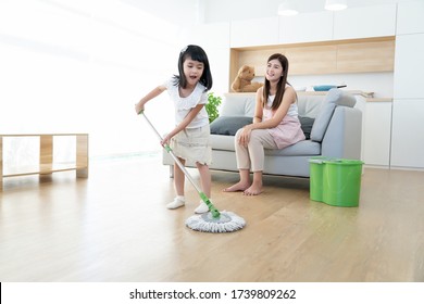 Asian Family Happy House Work Cleaning Together,mother Teach Kids Chore Help Home Work Dust Remove By Using Mob Clean Wooden Floor