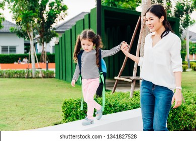 Asian Family Happy Nanny Mother Parent Her Smiling And Holding Hand In Hand Her Daughter Child Or Kid Going To School At Outdoors Garden, Back To School Concept