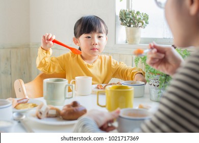 asian family having breakfast