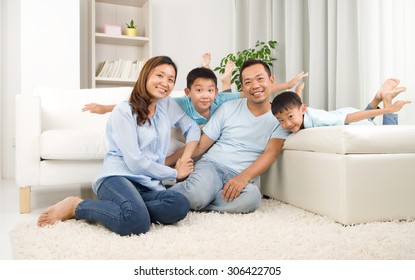 Asian Family Having Fun At Home