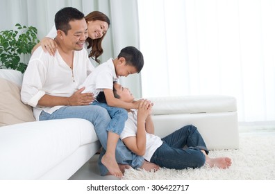 Asian Family Having Fun At Home