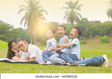 asian family having fun time at outdoor - Shutterstock ID 641860126