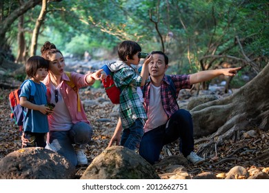 Asian Family Hiking In The Forest On Vacation Happy Time