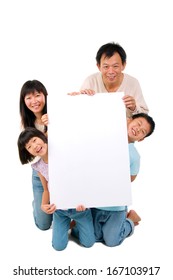 Asian Family Holding A White Board