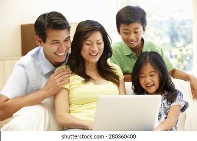 Asian Family With Laptop