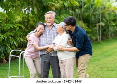 Asian family with love. 4 People. happy family shows love by hugging each other on the lawn at home. 