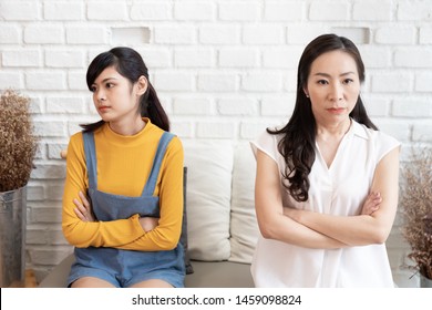 Asian Family Mom And Teenage Daughte Are Feeling Stressed And Angry, Not Talking After Dispute At Home. Family Conflict Concept