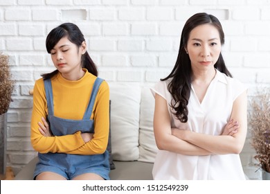 Asian Family Mom And Teenage Daughte Are Feeling Stressed And Angry, Not Talking After Dispute At Home. Family Conflict Concept