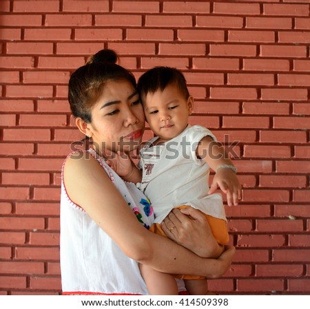 Asian family, Mother holding her baby, hug