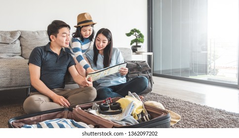 Asian Family Packing Bag/luggage And Planning To Travel On Summer Vacation