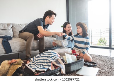 Asian Family Packing Bag/luggage And Planning To Travel On Summer Vacation