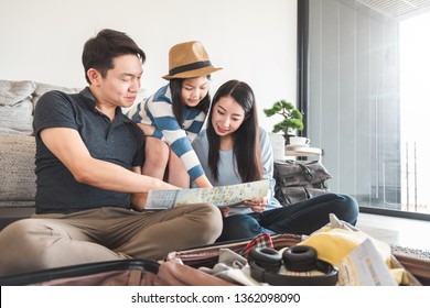 Asian Family Packing Bag/luggage And Planning To Travel On Summer Vacation