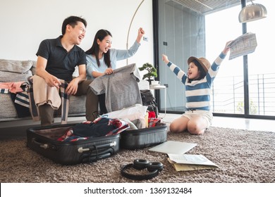 Asian Family Packing Bag/luggage And Planning To Travel On Summer Vacation