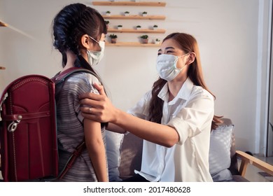 Asian Family Parent Mother Wearing Protective Surgical Face Mask On Child Daughter Before Go To School Learning Education, Safety Prevention Coronavirus Covid-19 Pandemic, Work From Home Quarantine