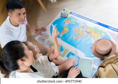 Asian Family Are Planning To Around The World. The Image Focus Plane Was Carrying A Child.