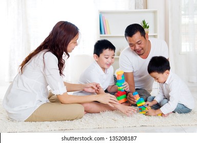 Asian Family Playing Building Blocks