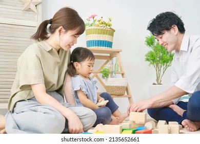 Asian Family Playing With Building Blocks At Home