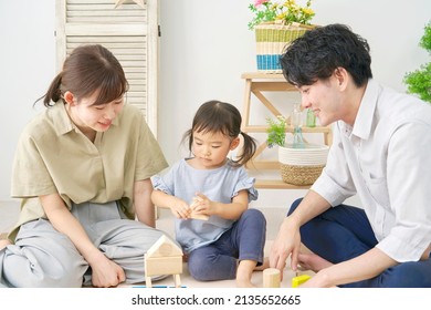 Asian Family Playing With Building Blocks At Home