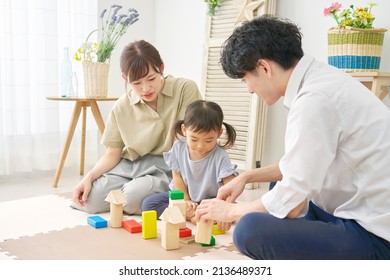 Asian Family Playing With Building Blocks At Home