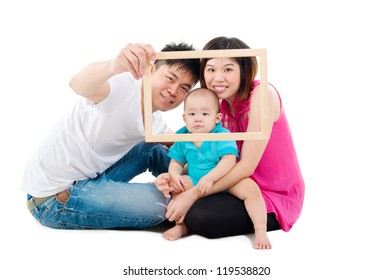 Asian Family Posing With A Wood Frame