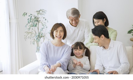 Asian Family Relaxing At Home