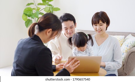 Asian family and salesman in the living room
