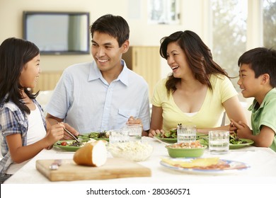 Asian Family Sharing Meal At Home