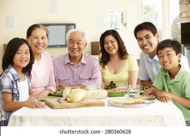 Asian Family Sharing Meal At Home