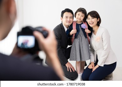 Asian Family Shooting A Commemorative Photo. Photo Studio.