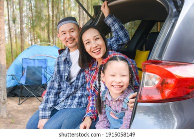 Asian Family Sitting In Car Trunk Going Camp On Vacations . Family Travel By Car.