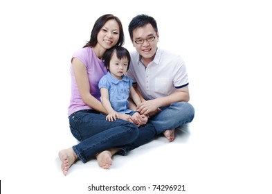 Asian Family Sitting With White Isolated Background