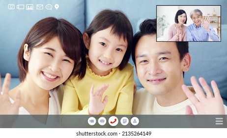 Asian Family Talking On A Two-screen Video Call. Video Phone.