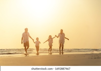 Asian family vacation at the beach with family relationships caused love and understanding to strengthen social immunity. Happy summer vacations holiday asian people. Holiday travel freedom.