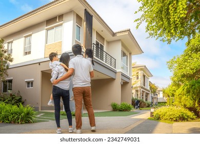 Asian family walking togather with Mother father and daughter in home village, Park in Bangkok city, Thailand - Powered by Shutterstock