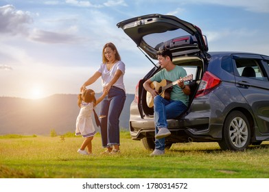 Asian Family.happy Little Girl With Family Sitting In The Car.Car Insurance Concept