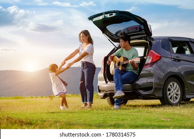 Asian Family.happy Little Girl With Family Sitting In The Car.Car Insurance Concept