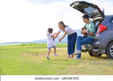 Asian Family.happy Little Girl With Family Sitting In The Car.Car Insurance Concept