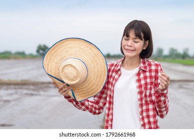 Asian Farmer Woman Wear Red Shirt Standing And Cry With Sad Emotion At Rice Farm Outdoor