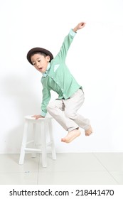 Asian Fashion Kid Jump With White Background 