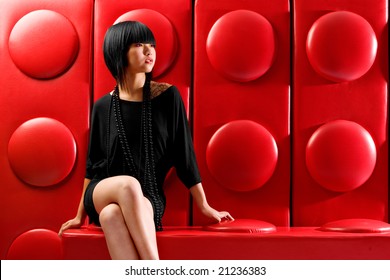 Asian Fashion Model On Red Background