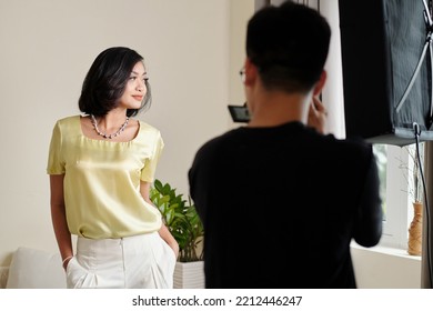 Asian Fashion Model Posing To Photographer During Professional Shooting