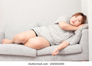 Asian Fat Girl Sitting On The Sofa