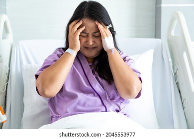 Asian Fat Woman Patient Feeling Sad And Depressed Lying At Hospital Bed